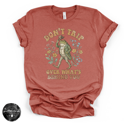 Don’t Trip Over What’s Behind You Tee | Inspirational Graphic T-Shirt