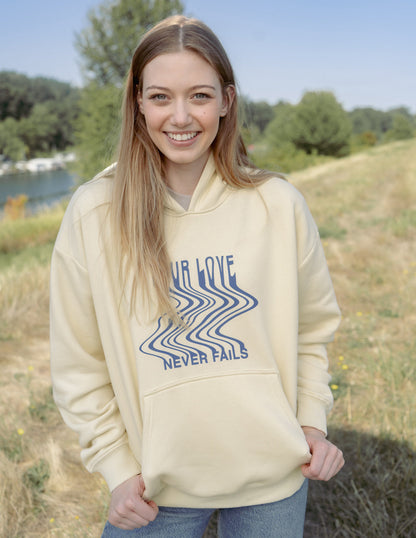 Elevated Faith Love Never Fails Cream Unisex Hoodie