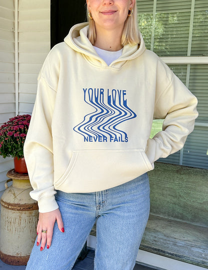 Elevated Faith Love Never Fails Cream Unisex Hoodie