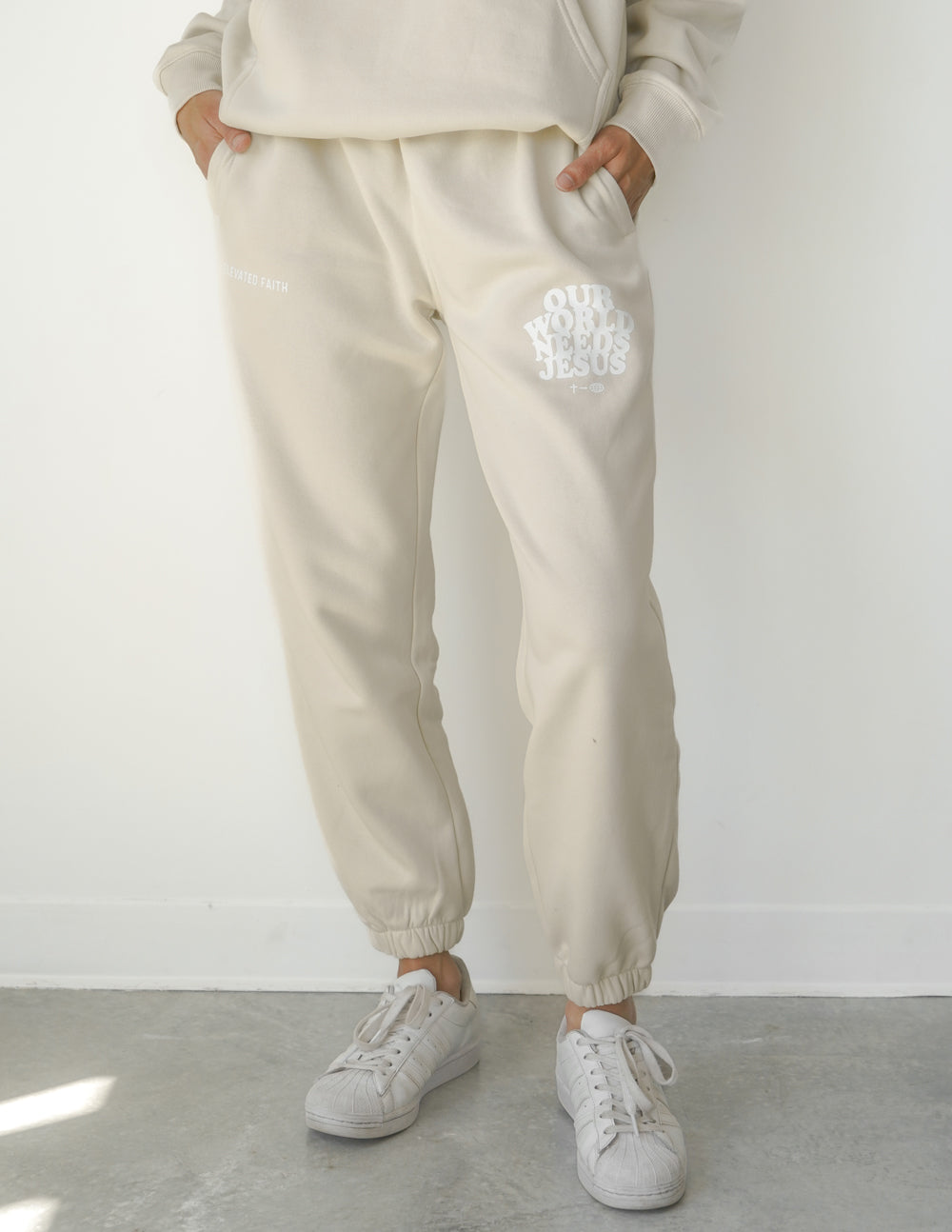 Elevated Faith Our World Needs Jesus Beige Unisex Sweatpant