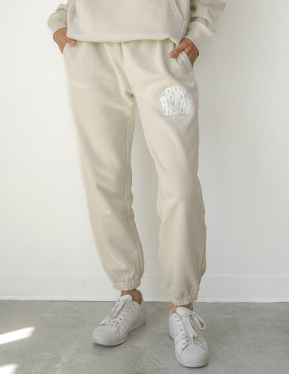 Elevated Faith Our World Needs Jesus Beige Unisex Sweatpant