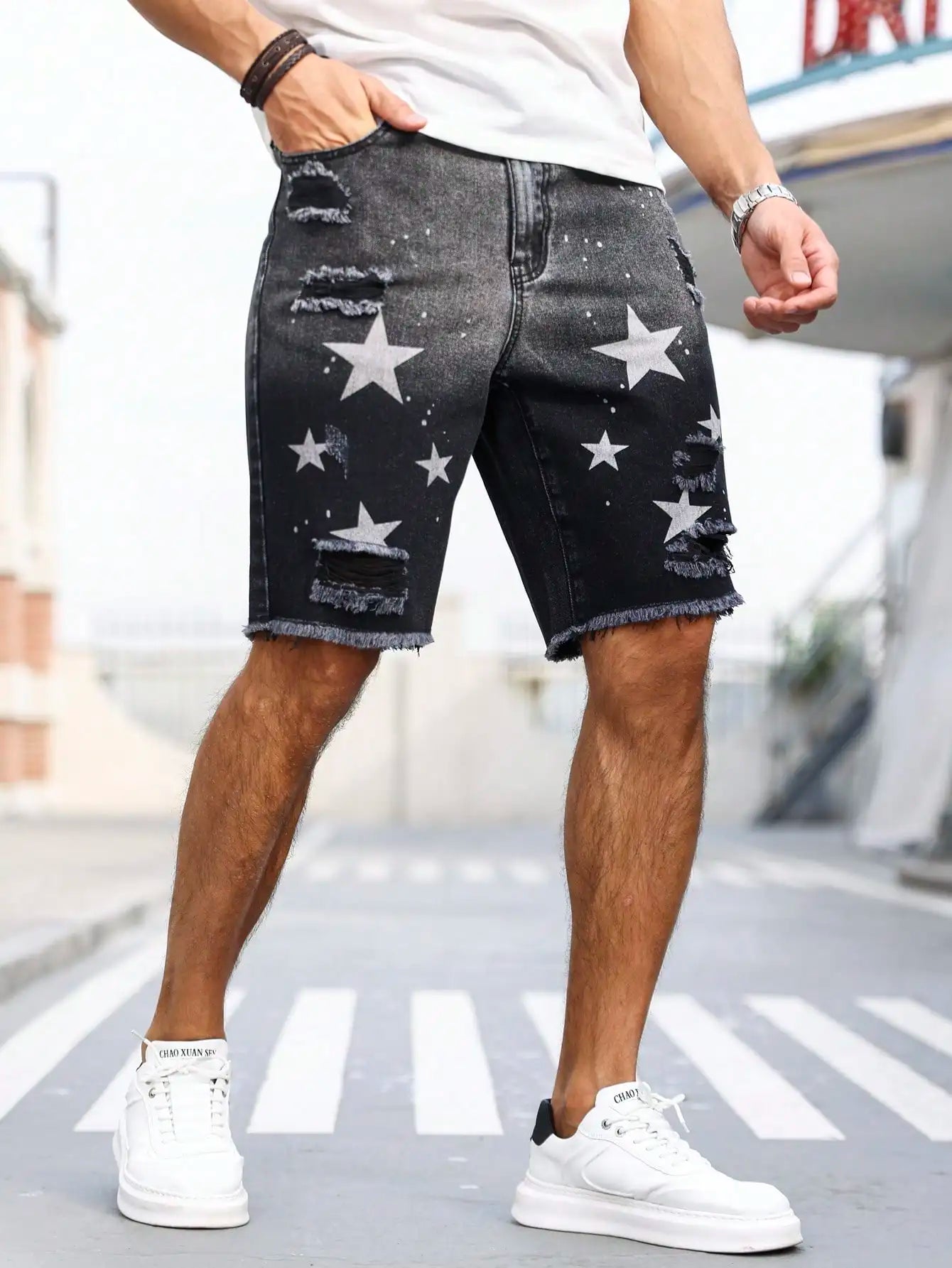 Men's summer denim printed shorts. Black - grey gradient color. Ripped details. Street - style trend.