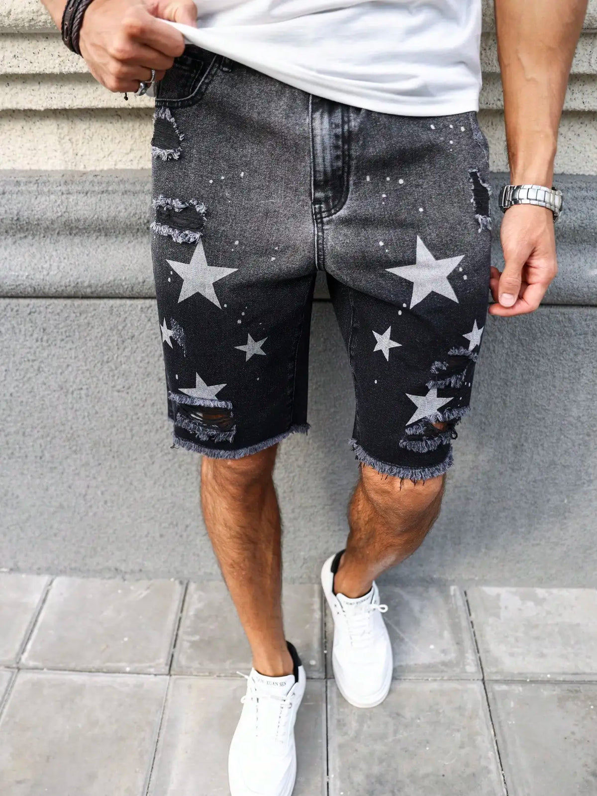 Men's summer denim printed shorts. Black - grey gradient color. Ripped details. Street - style trend.