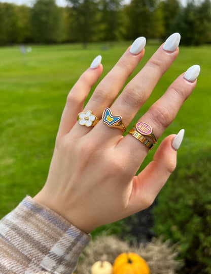 Elevated Faith White Smiley Flower Ring