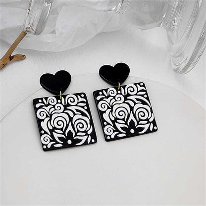 Black Acrylic Heart Swirl Earrings