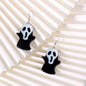 Black Acrylic & Silvertone Ghost Drop Earrings